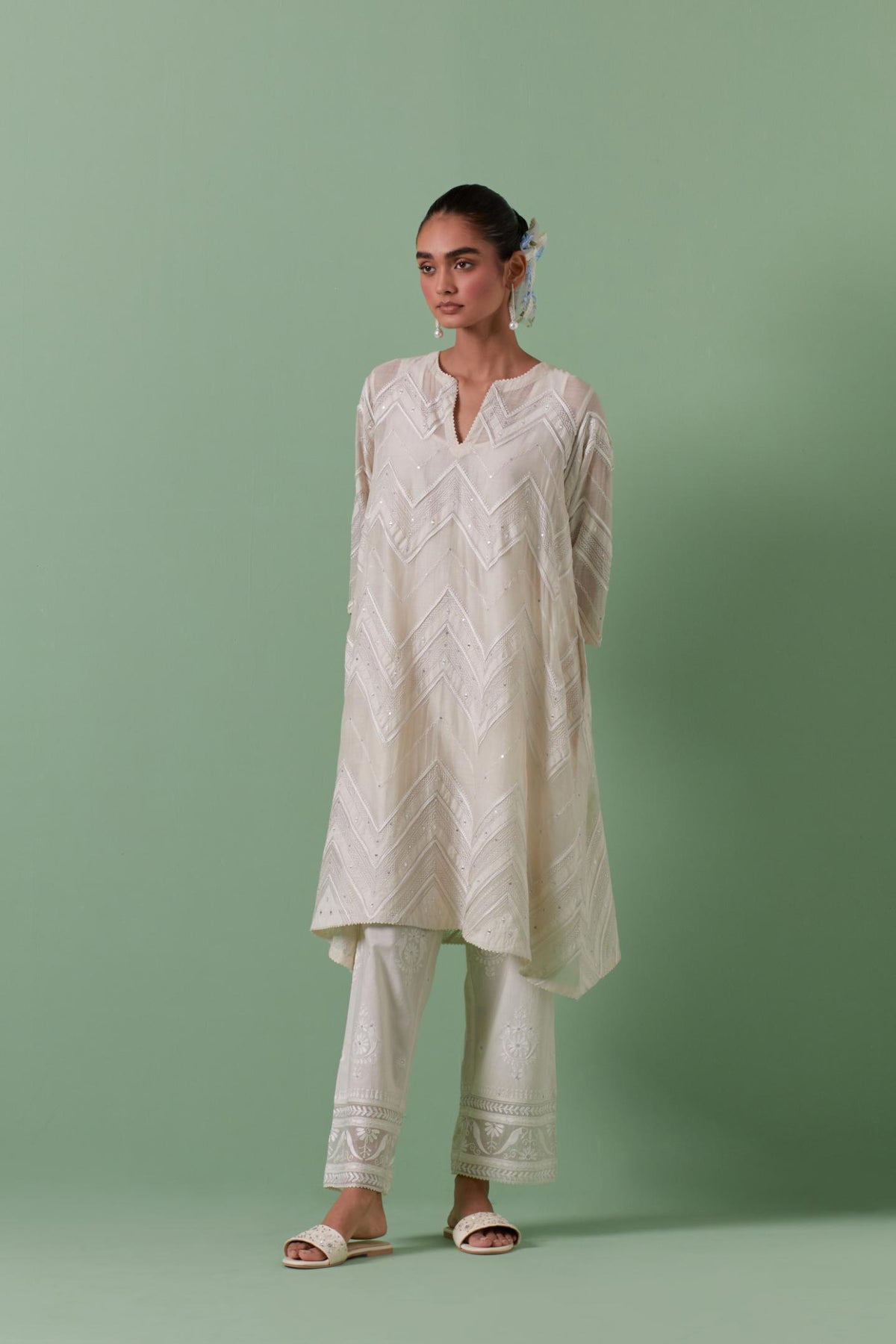 Off-white cotton chanderi A-line kurta set with all over embroidery set in bold chevron stripes.