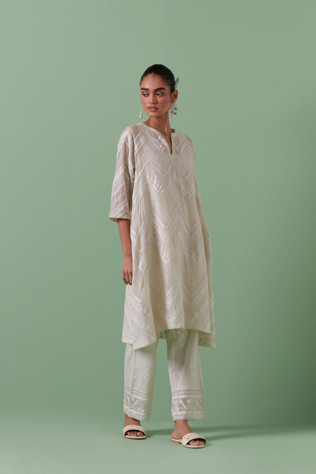 Off-white cotton chanderi A-line kurta set with all over embroidery set in bold chevron stripes.