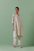 Off-white cotton chanderi A-line kurta set with all over embroidery set in bold chevron stripes.