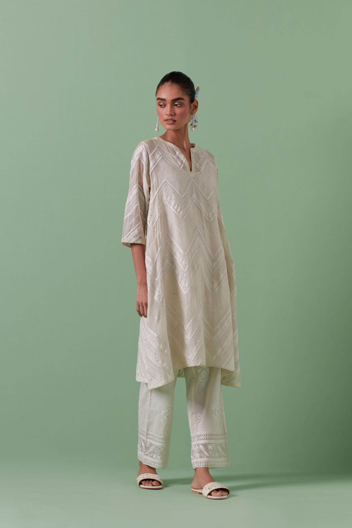 Off-white cotton chanderi A-line kurta set with all over embroidery set in bold chevron stripes.