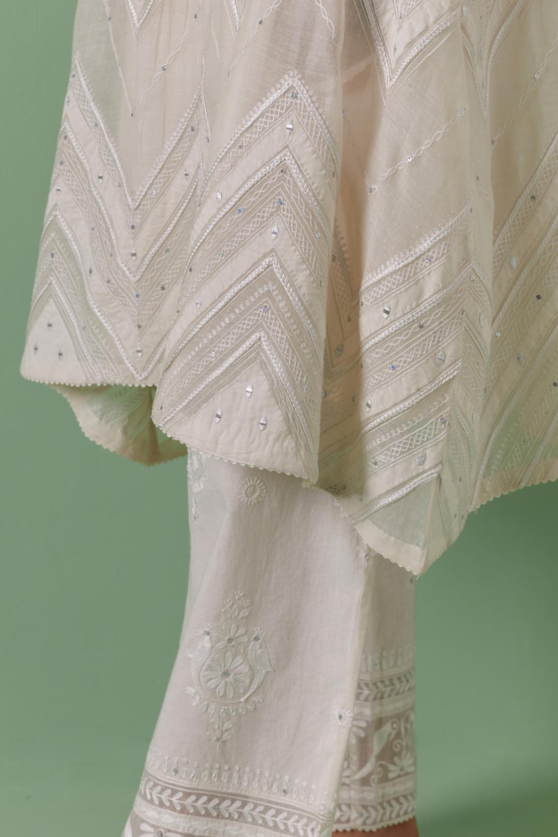 Off-white cotton chanderi A-line kurta set with all over embroidery set in bold chevron stripes.