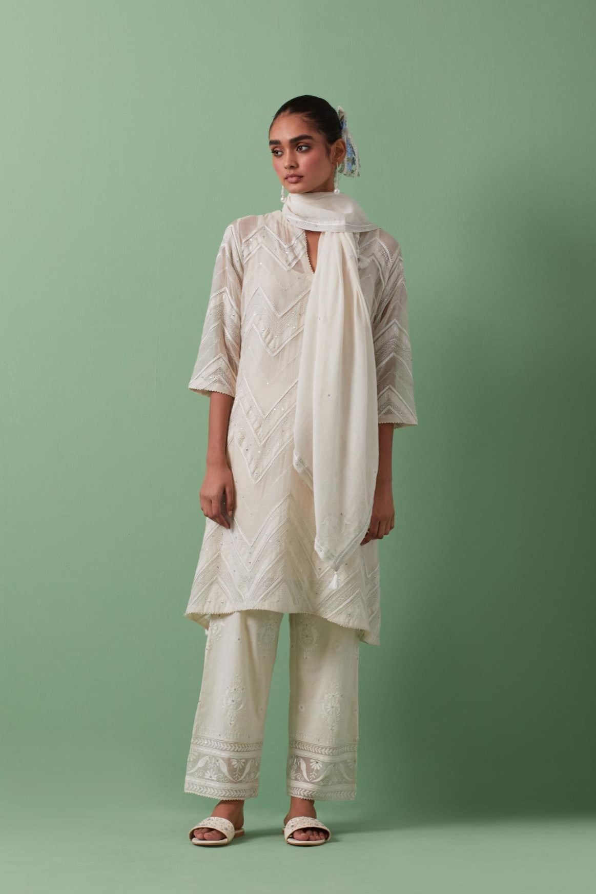 Off-white cotton square scarf with delicate silk thread embroidery, highlighted with braids, mirrors and sequins.