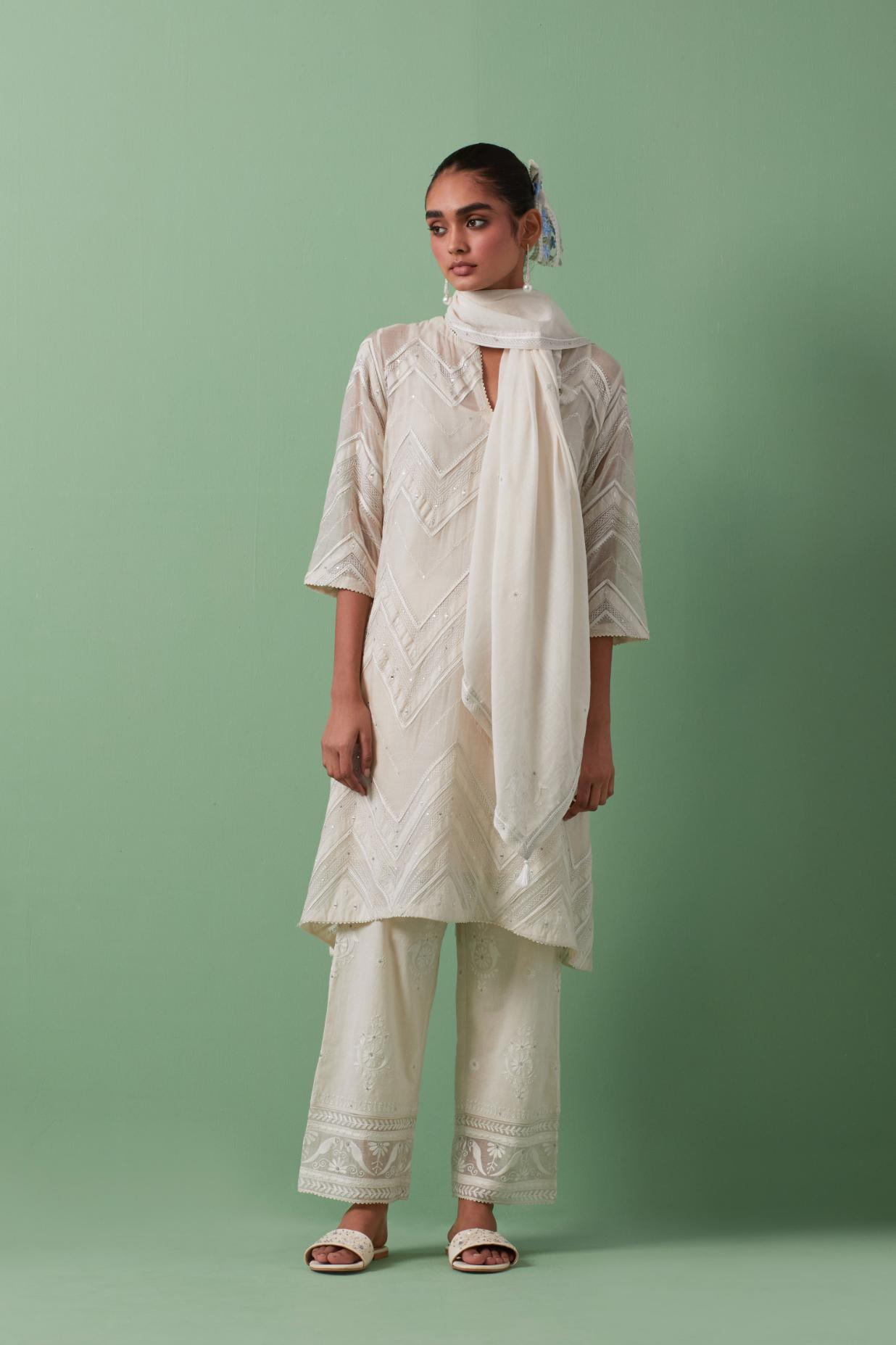 Off-white cotton chanderi A-line kurta set with all over embroidery set in bold chevron stripes.