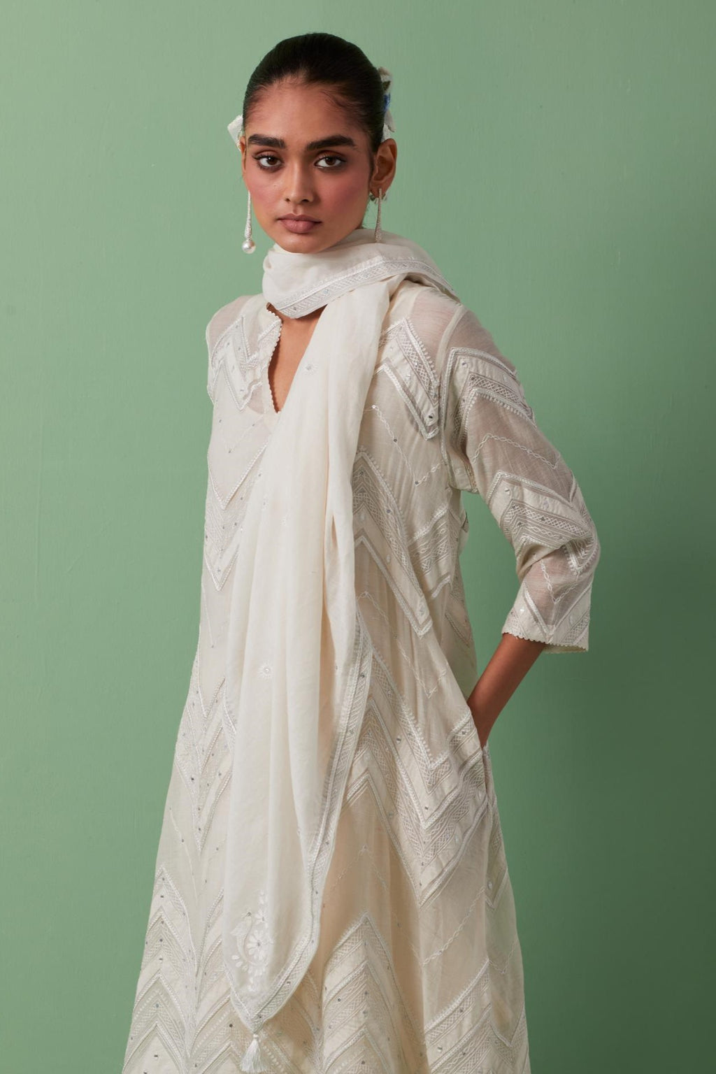 Off-white cotton square scarf with delicate silk thread embroidery, highlighted with braids, mirrors and sequins.