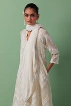 Off-white cotton square scarf with delicate silk thread embroidery, highlighted with braids, mirrors and sequins.