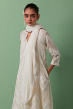 Off-white cotton chanderi A-line kurta set with all over embroidery set in bold chevron stripes.