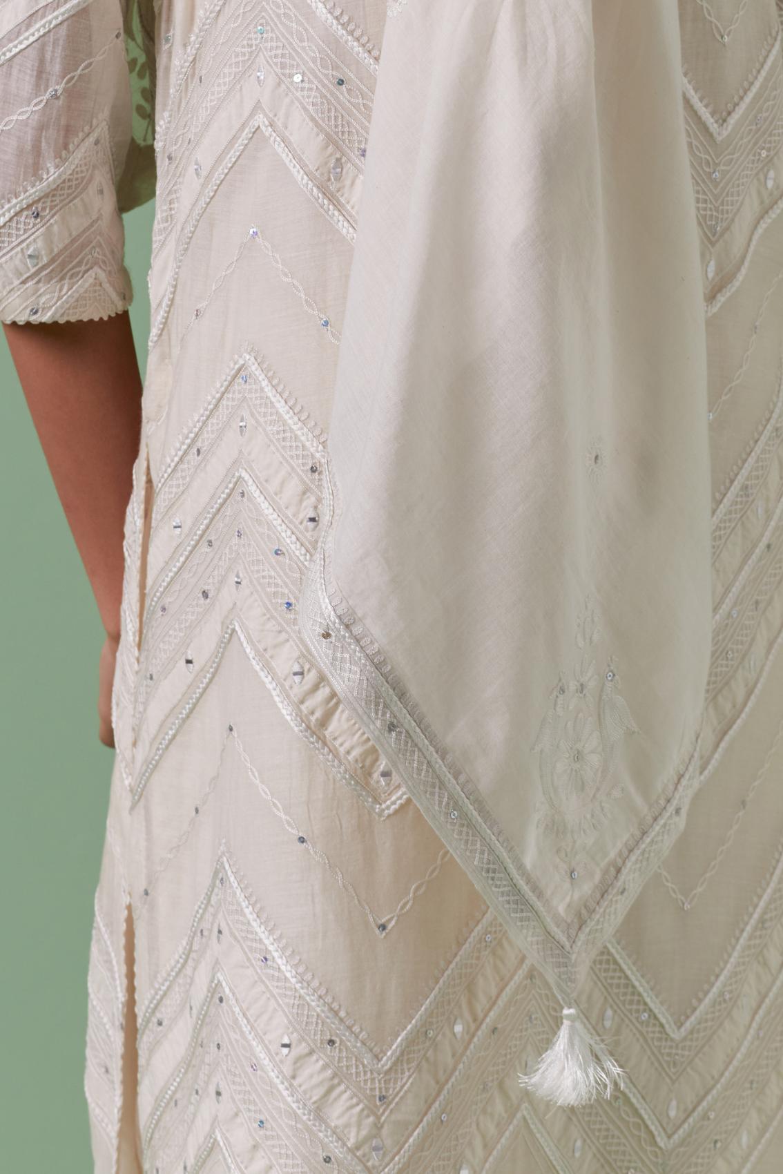 Off-white cotton chanderi A-line kurta set with all over embroidery set in bold chevron stripes.
