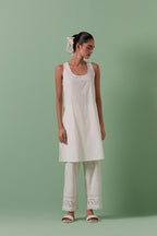 Off-white cotton chanderi A-line kurta set with all over embroidery set in bold chevron stripes.