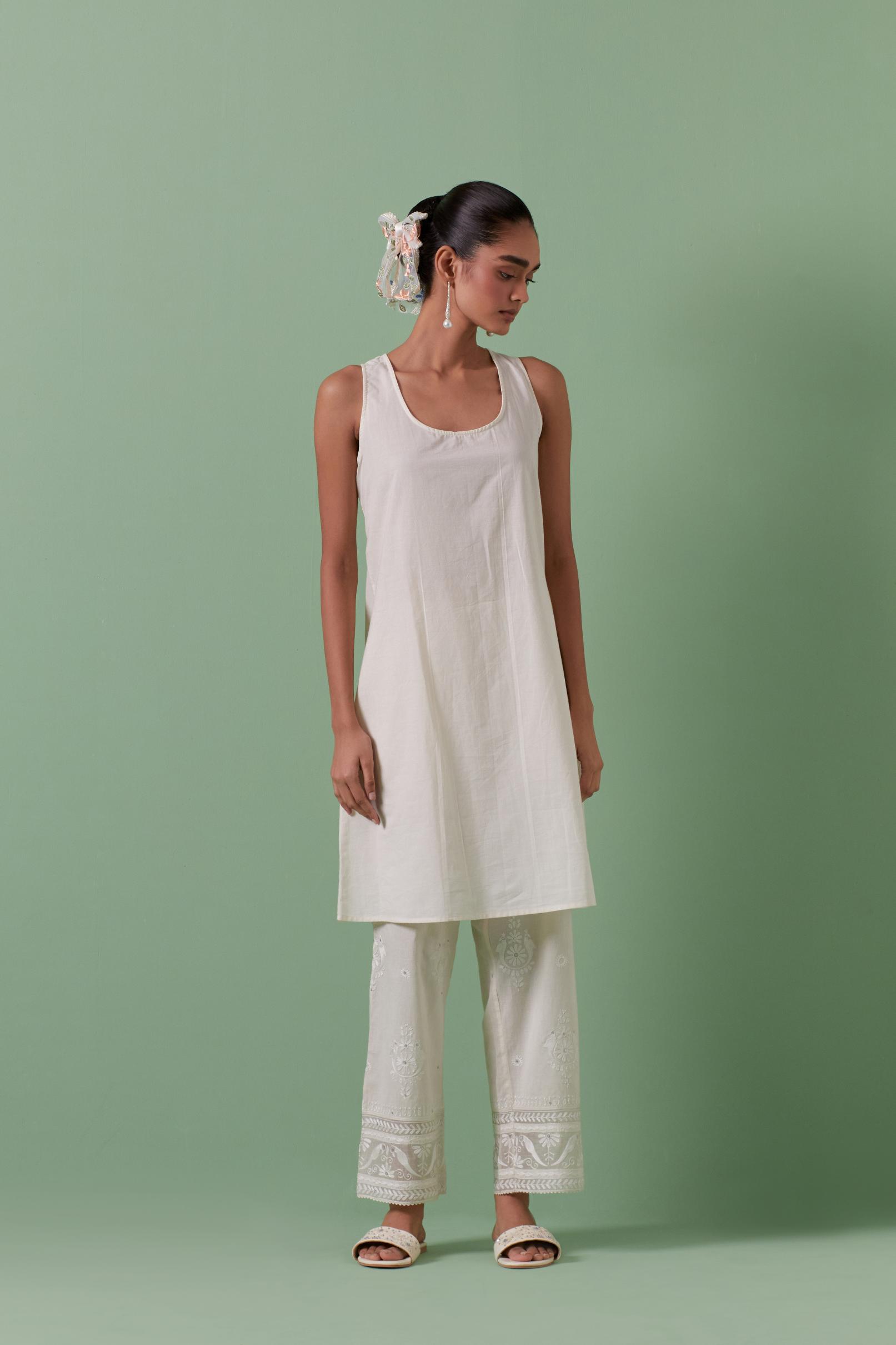Off-white cotton chanderi A-line kurta set with all over embroidery set in bold chevron stripes.