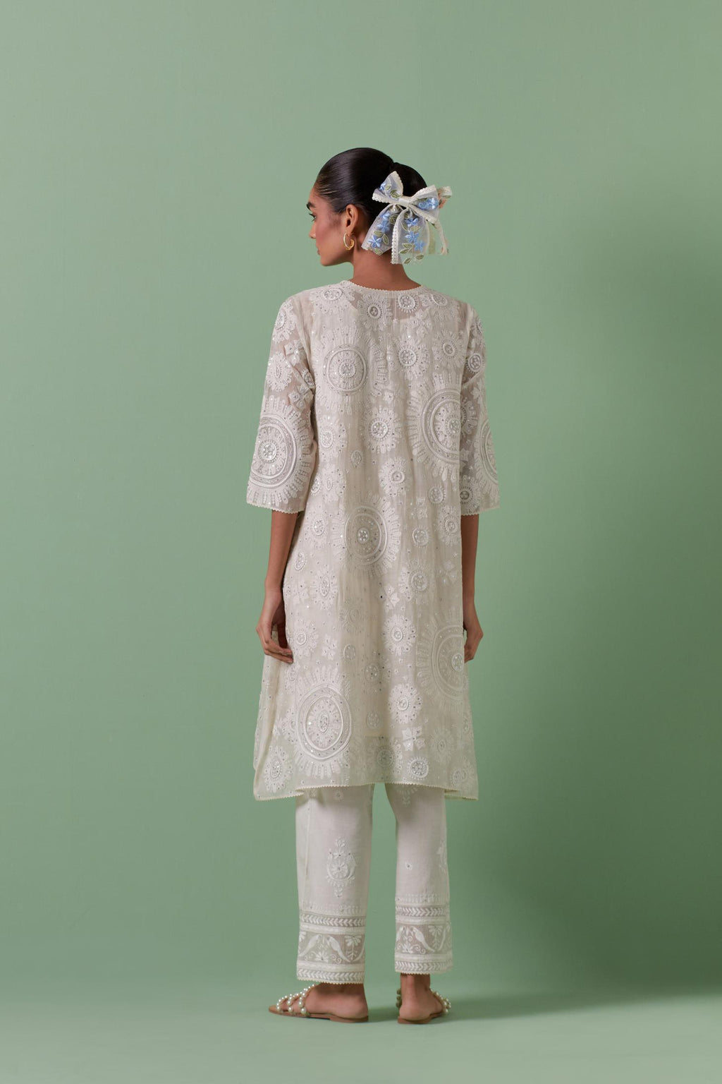 Off-white A-line cotton chanderi kurta set with all over patchwork, silk thread, mirror, tassels embroidery and sequins.