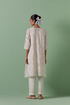 Off-white A-line cotton chanderi kurta set with all over patchwork, silk thread, mirror, tassels embroidery and sequins.
