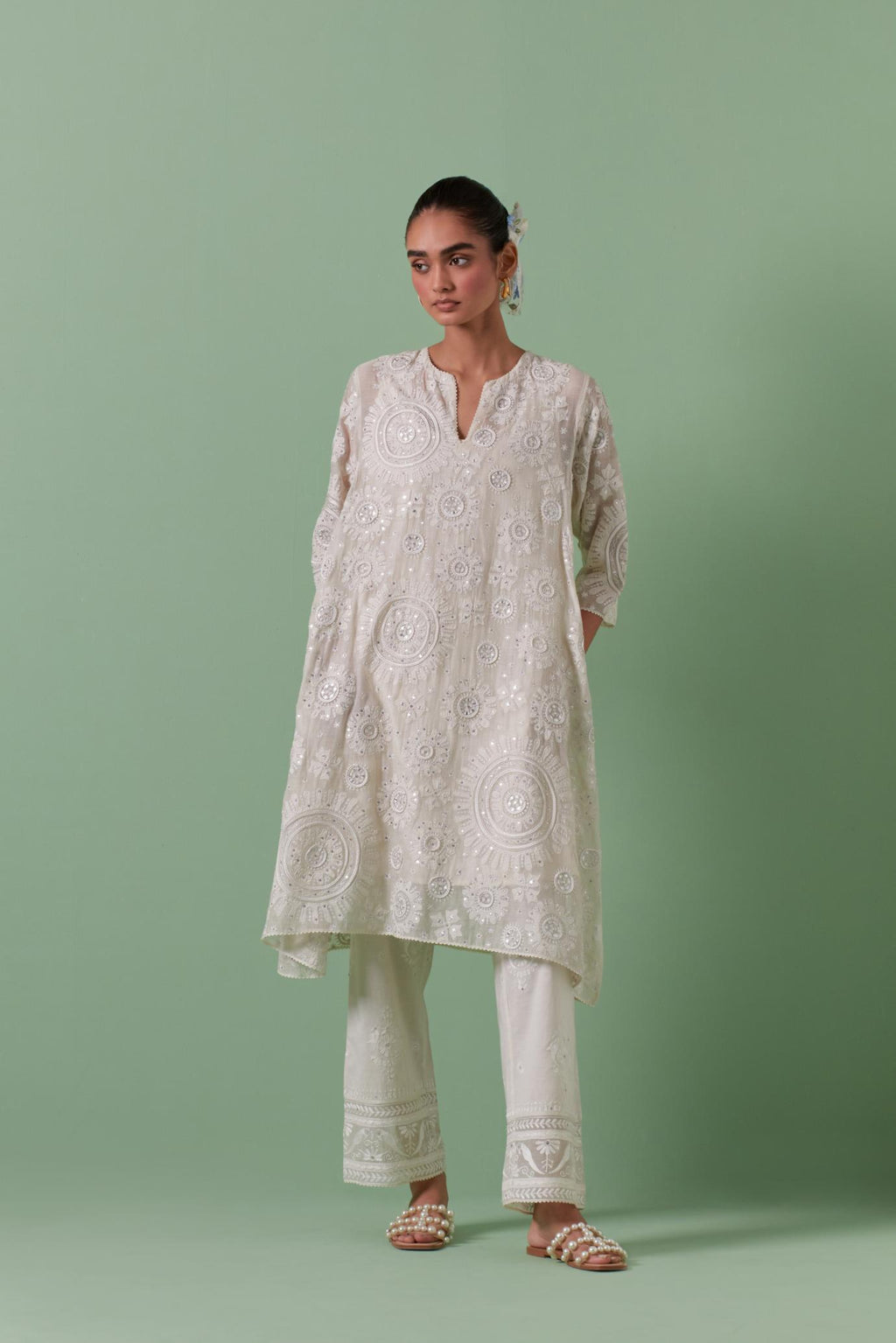 Off-white A-line cotton chanderi kurta set with all over patchwork, silk thread, mirror, tassels embroidery and sequins.