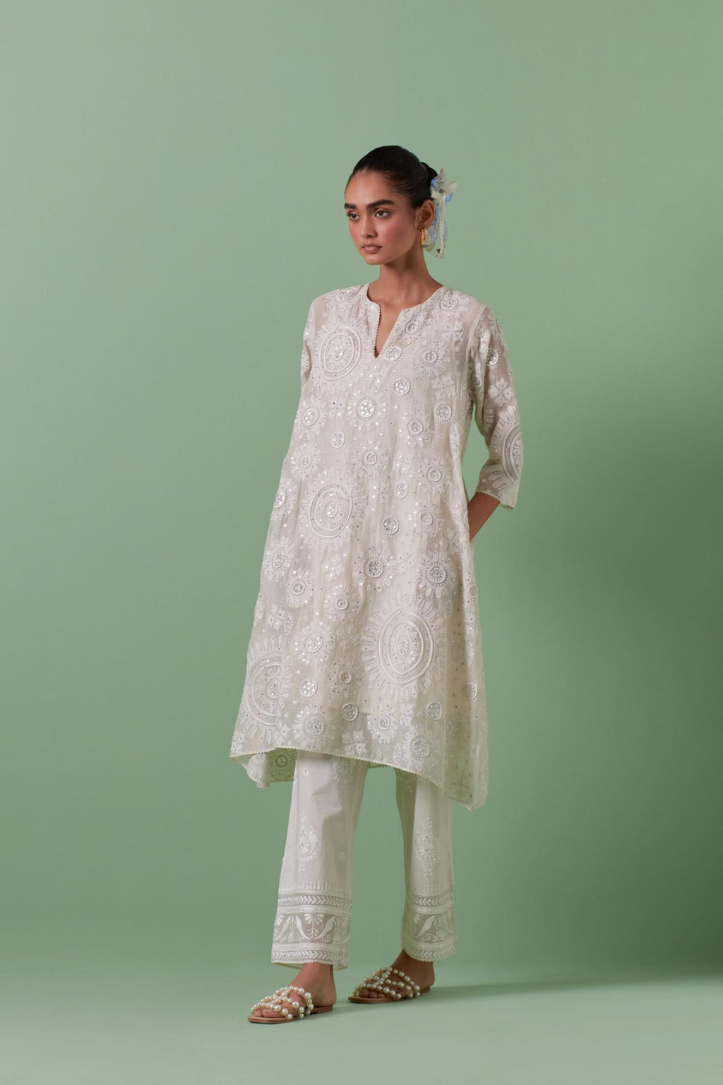 Off-white A-line cotton chanderi kurta set with all over patchwork, silk thread, mirror, tassels embroidery and sequins.