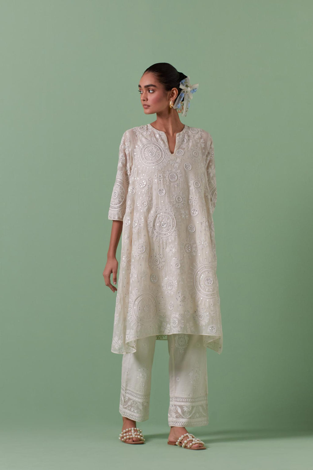 Off-white A-line cotton chanderi kurta set with all over patchwork, silk thread, mirror, tassels embroidery and sequins.