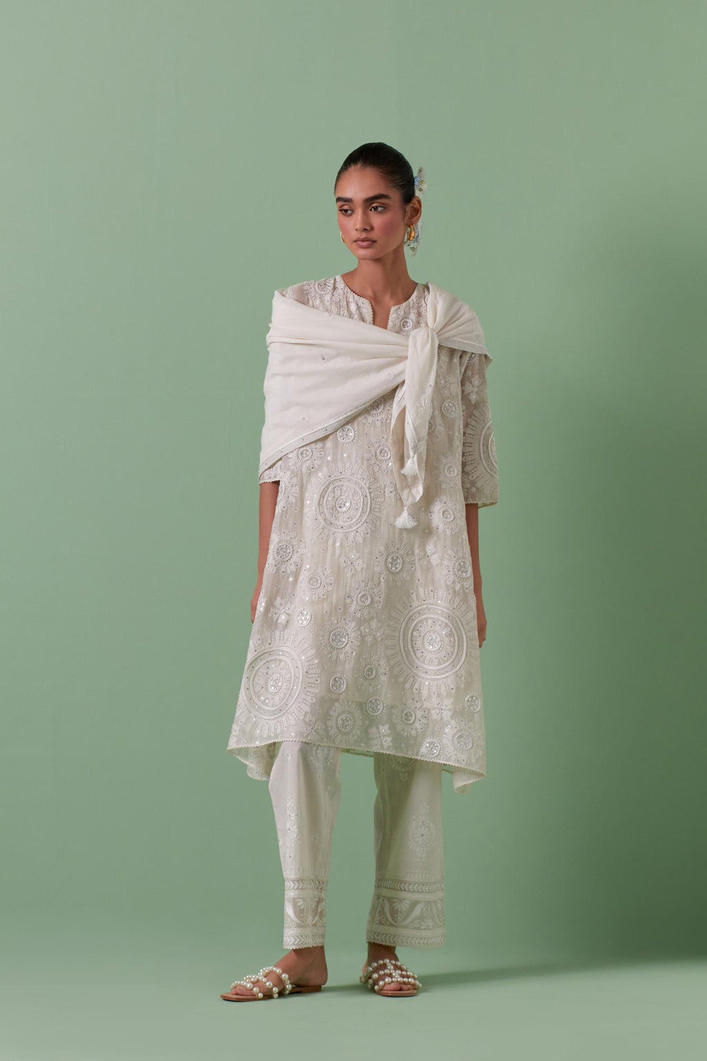 Off-white A-line cotton chanderi kurta set with all over patchwork, silk thread, mirror, tassels embroidery and sequins.