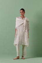 Off-white A-line cotton chanderi kurta set with all over patchwork, silk thread, mirror, tassels embroidery and sequins.