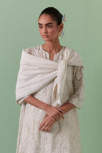 Off-white A-line cotton chanderi kurta set with all over patchwork, silk thread, mirror, tassels embroidery and sequins.