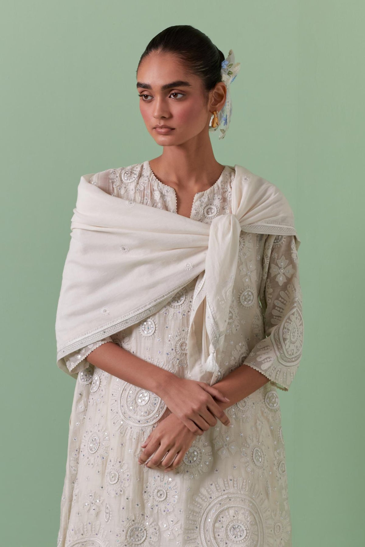 Off-white A-line cotton chanderi kurta set with all over patchwork, silk thread, mirror, tassels embroidery and sequins.