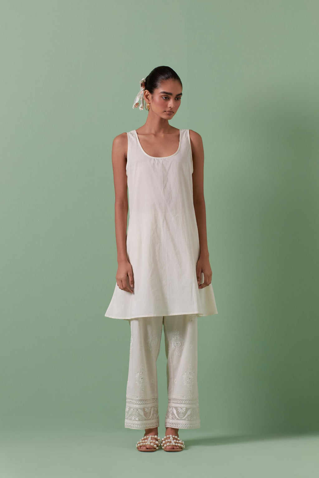 Off-white A-line cotton chanderi kurta set with all over patchwork, silk thread, mirror, tassels embroidery and sequins.