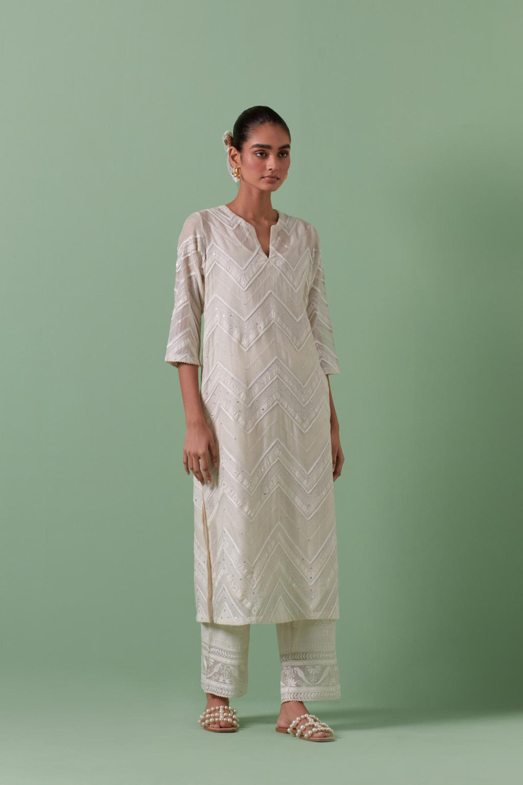 Off-white cotton chanderi straight kurta set with all over chevron pattern. It is embellished with silk patchwork, thread, sequins and mirrors.