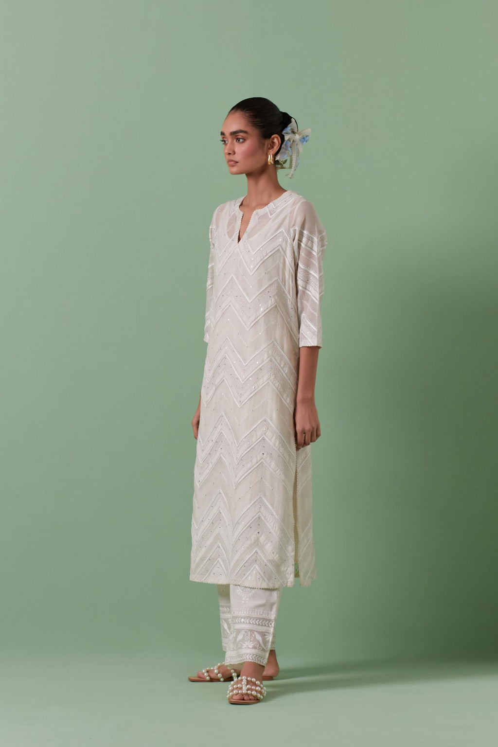 Off-white cotton chanderi straight kurta set with all over chevron pattern. It is embellished with silk patchwork, thread, sequins and mirrors.