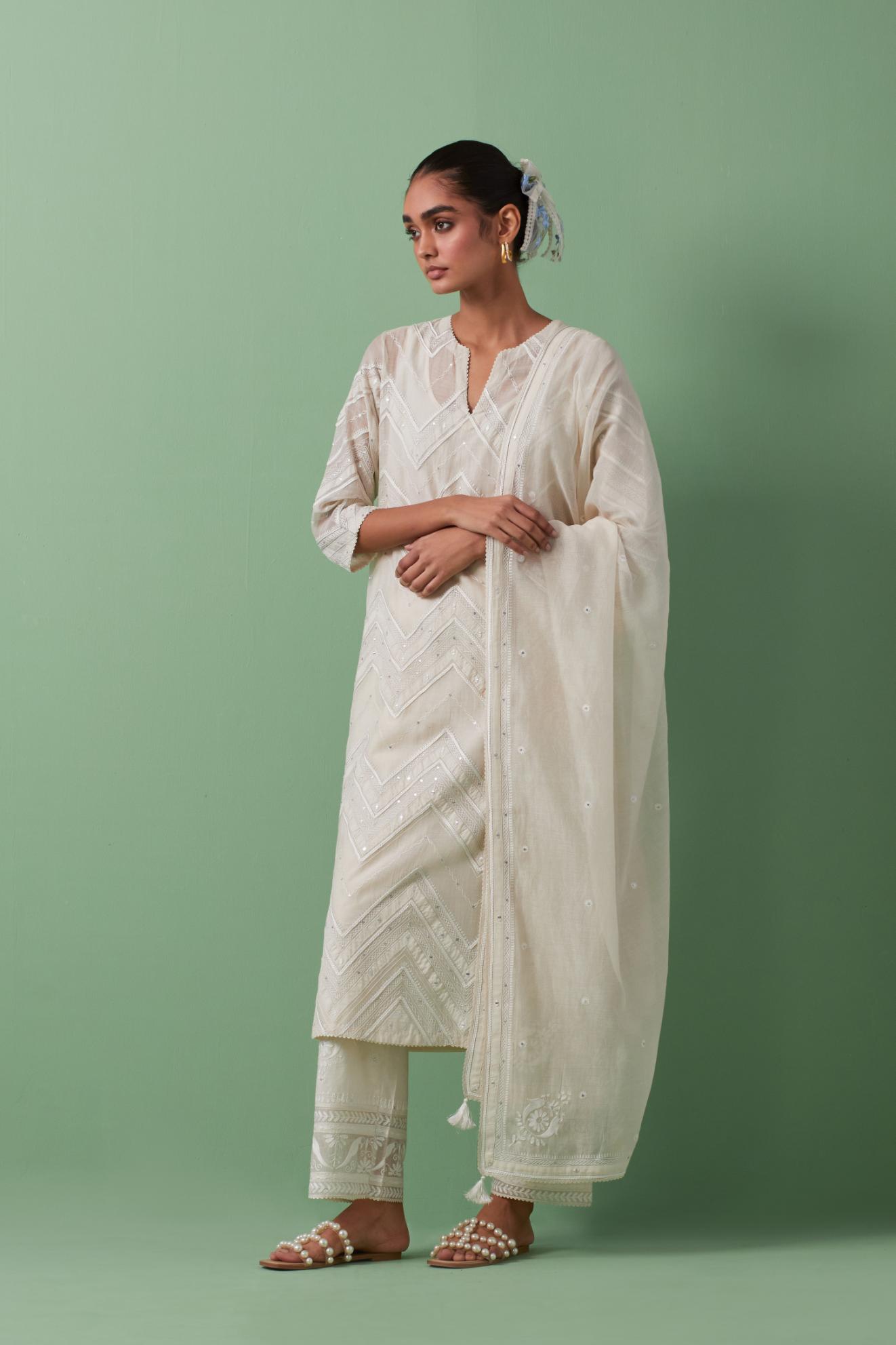 Off-white cotton chanderi straight kurta set with all over chevron pattern. It is embellished with silk patchwork, thread, sequins and mirrors.