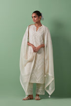 Off-white cotton chanderi straight kurta set with all over chevron pattern. It is embellished with silk patchwork, thread, sequins and mirrors.