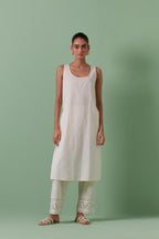 Off-white cotton chanderi straight kurta set with all over chevron pattern. It is embellished with silk patchwork, thread, sequins and mirrors.