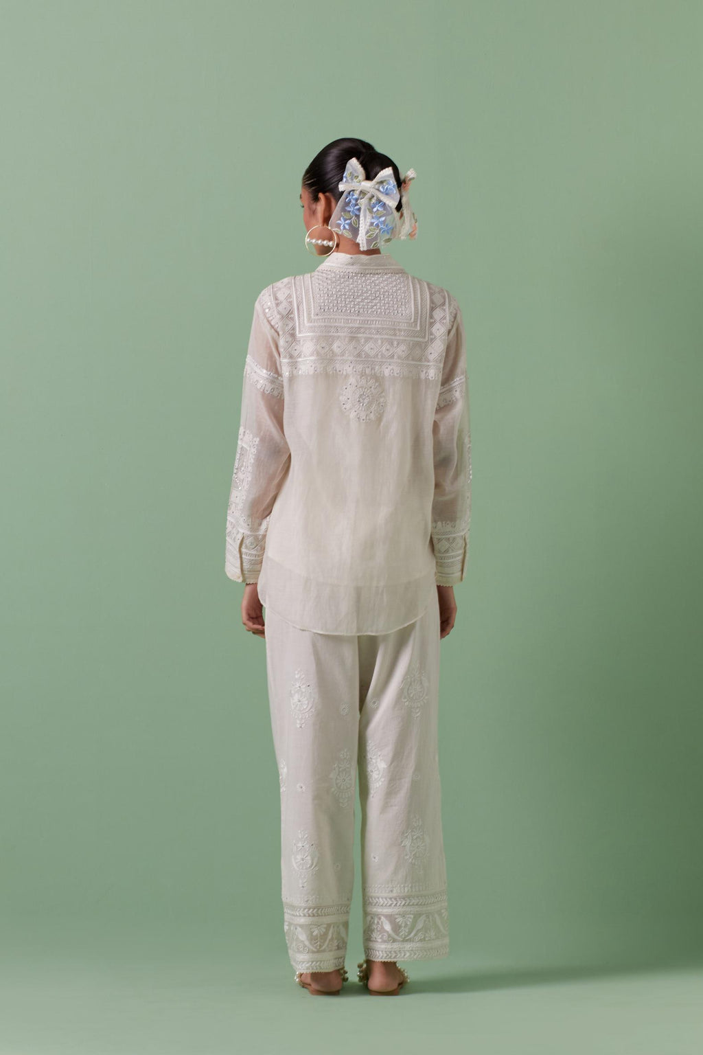 Off-white cotton chanderi embroidered shirt with full sleeves, paired with off white cotton straight pants with all over off white color embroidery detailed with sequins.