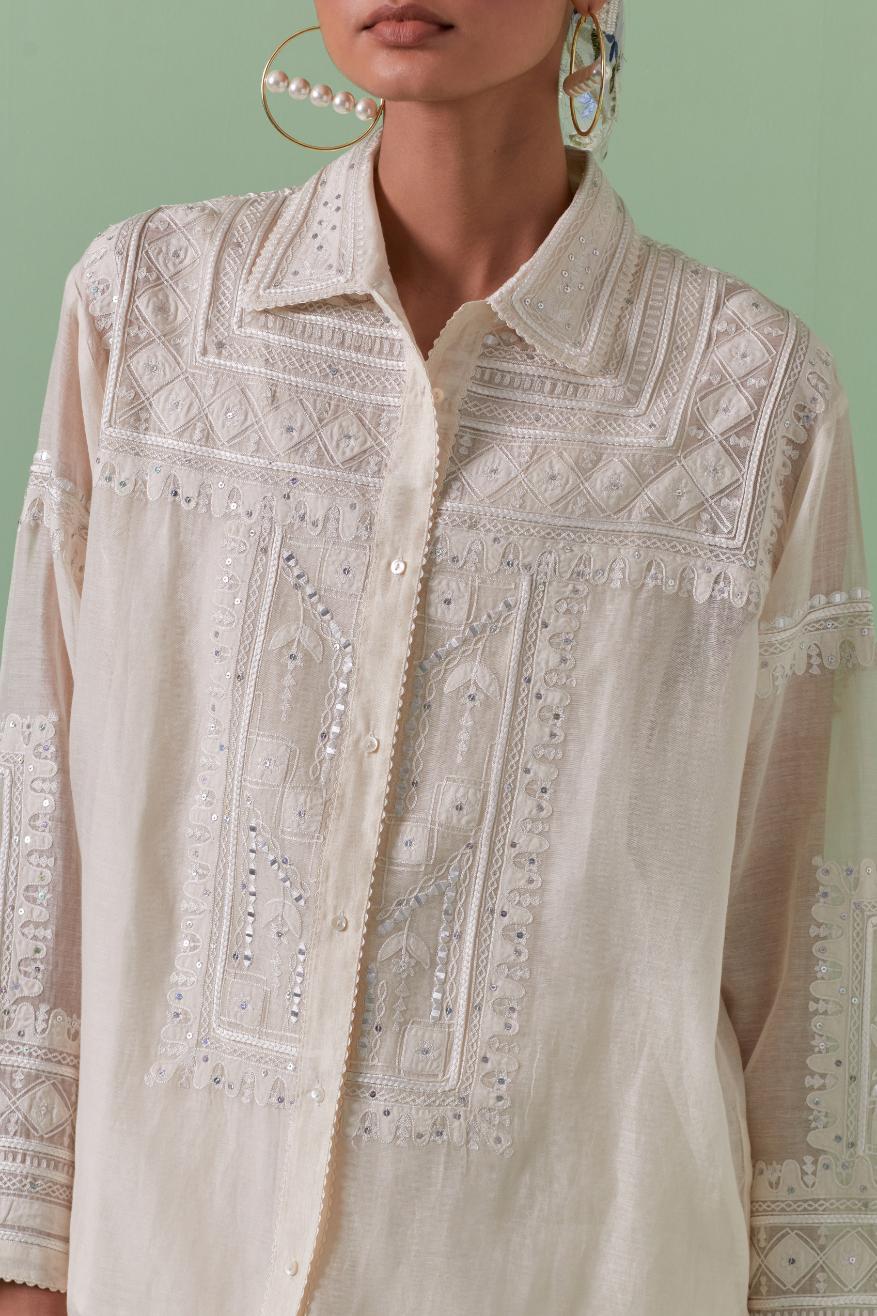Off-white cotton chanderi embroidered shirt with full sleeves, paired with off white cotton straight pants with all over off white color embroidery detailed with sequins.