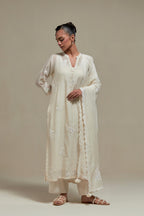 Off white cotton Chanderi dupatta, highlighted with all-over delicate sequins flower and appliqué motifs at dupatta corners.
