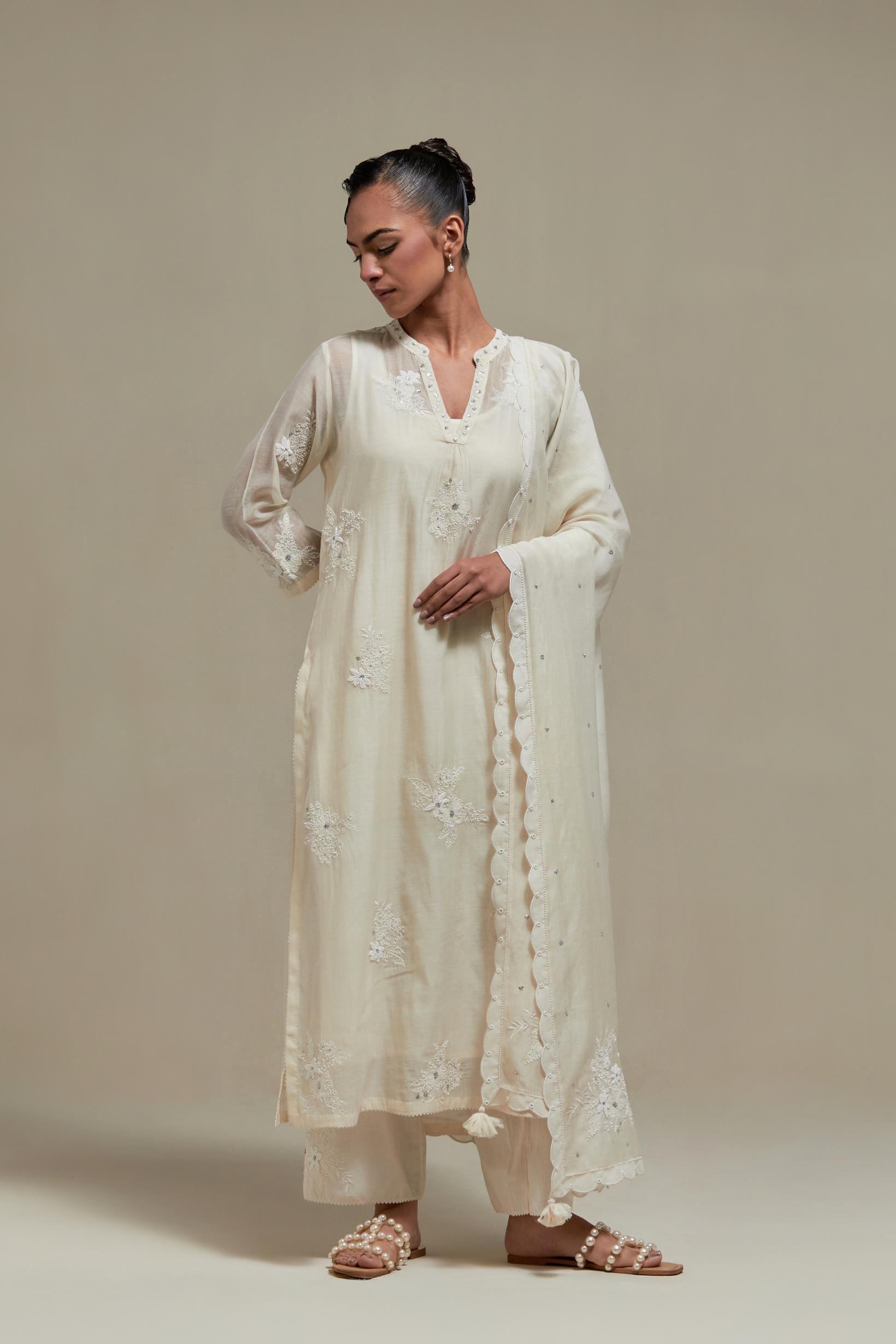 Off white cotton Chanderi dupatta, highlighted with all-over delicate sequins flower and appliqué motifs at dupatta corners.
