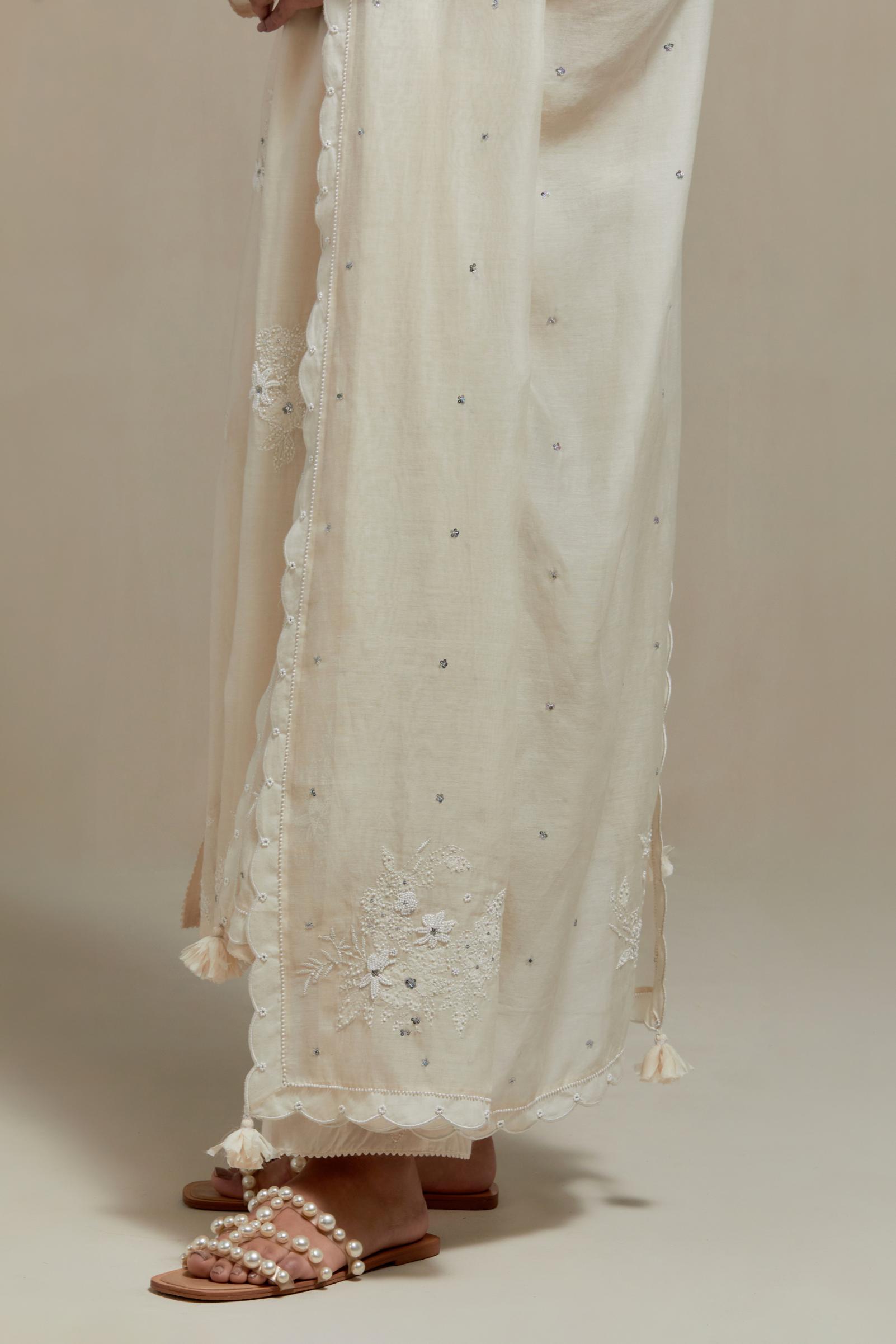 Off white cotton Chanderi dupatta, highlighted with all-over delicate sequins flower and appliqué motifs at dupatta corners.