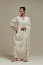 Off white cotton Chanderi dupatta, highlighted with all-over delicate sequins flower and appliqué motifs at dupatta corners.