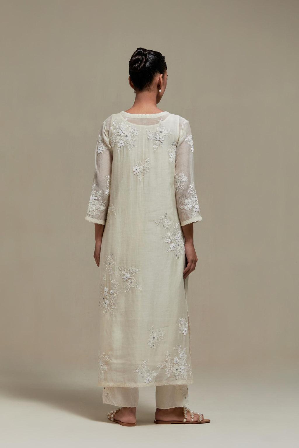 Off white cotton Chanderi short kurta set with all-over appliqué, highlighted with sequins and beads.