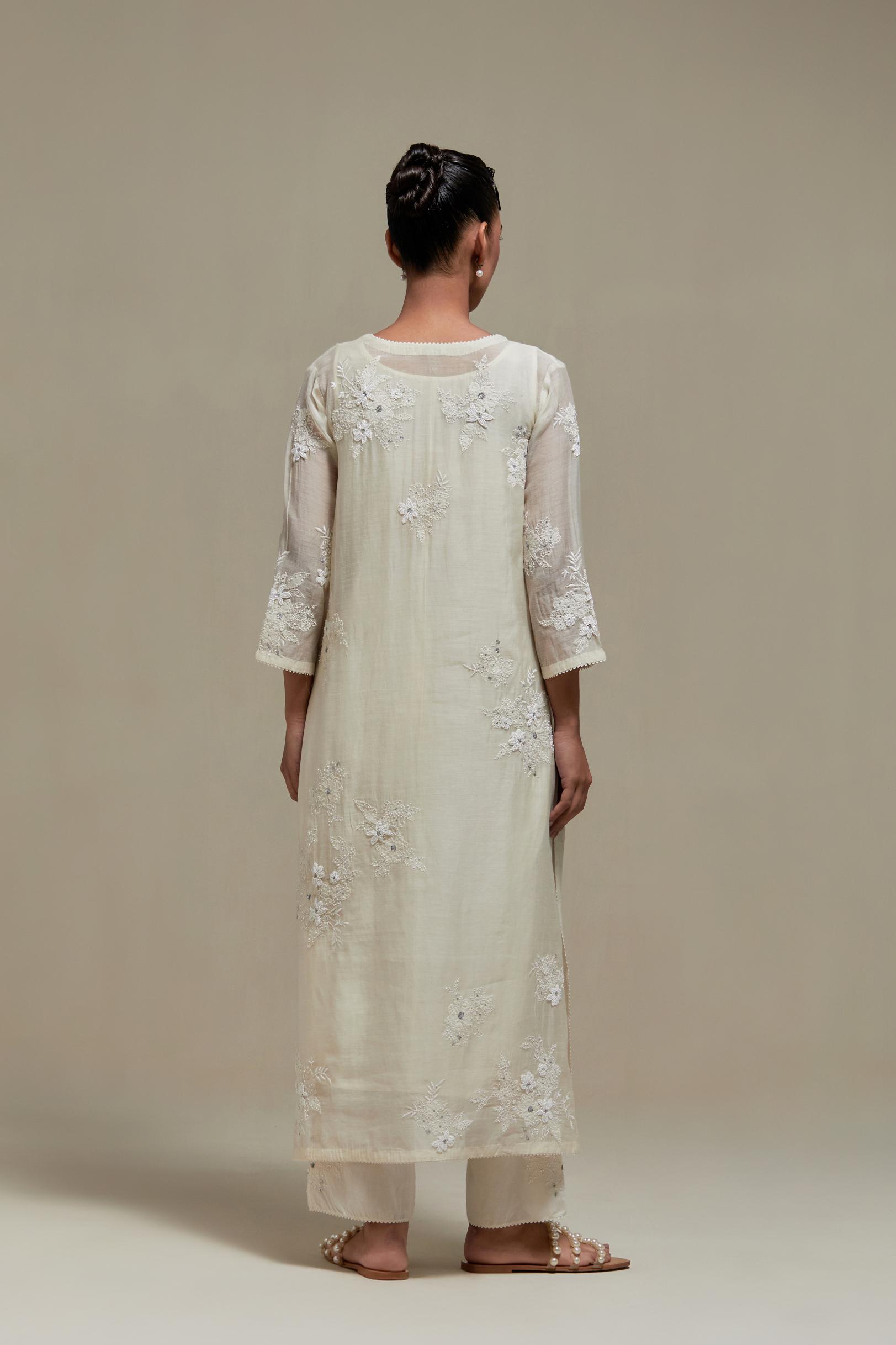 Off white cotton Chanderi short kurta set with all-over appliqué, highlighted with sequins and beads.