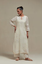 Off white cotton Chanderi short kurta set with all-over appliqué, highlighted with sequins and beads.