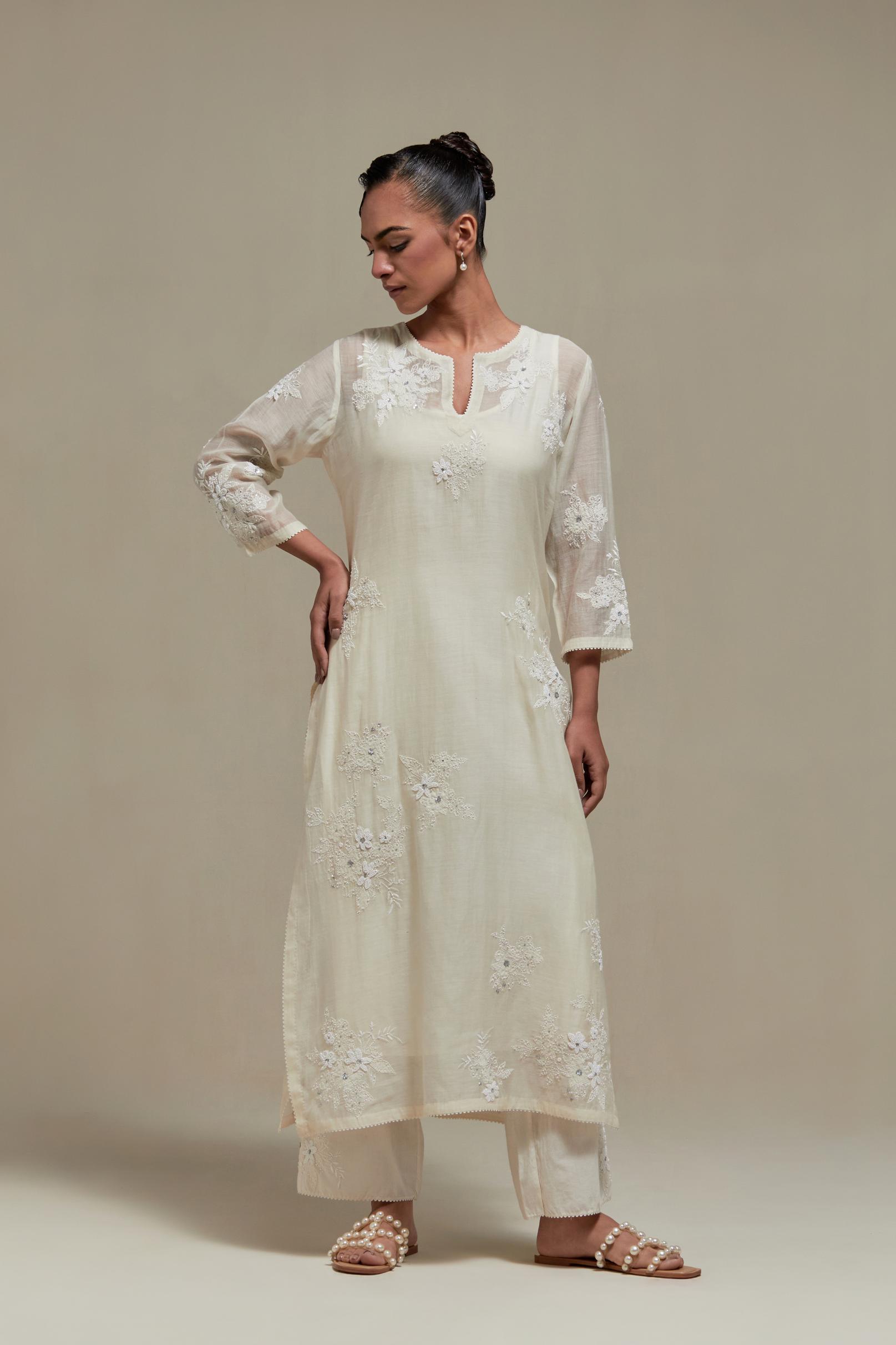 Off white cotton Chanderi short kurta set with all-over appliqué, highlighted with sequins and beads.