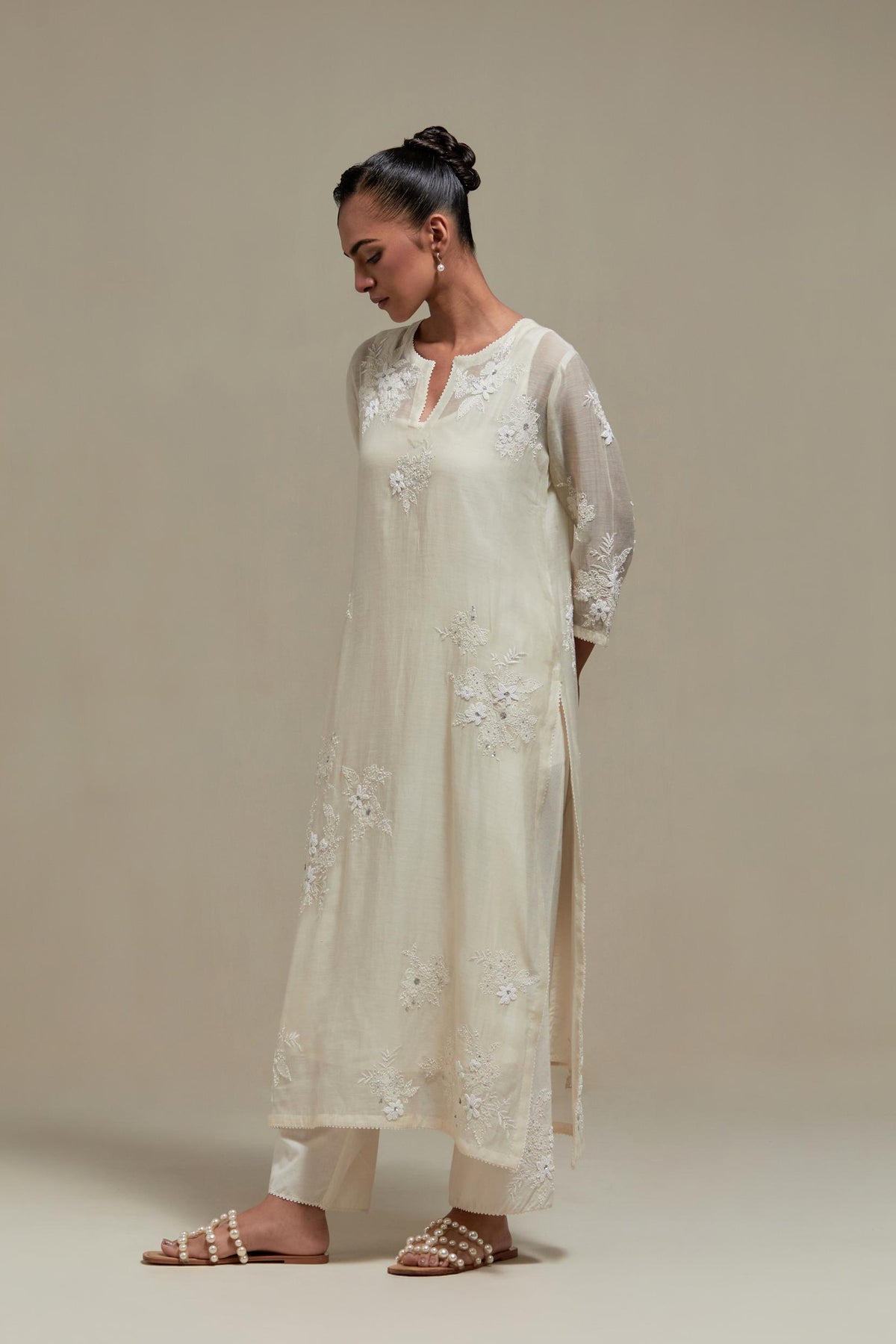 Off white cotton Chanderi short kurta set with all-over appliqué, highlighted with sequins and beads.