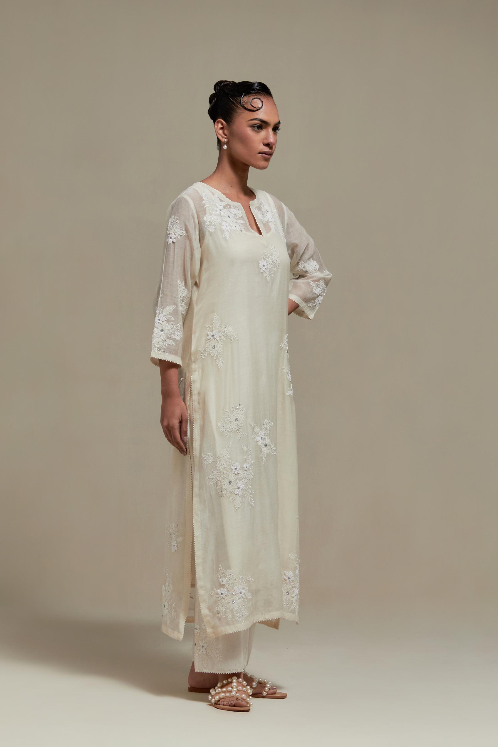 Off white cotton Chanderi short kurta set with all-over appliqué, highlighted with sequins and beads.