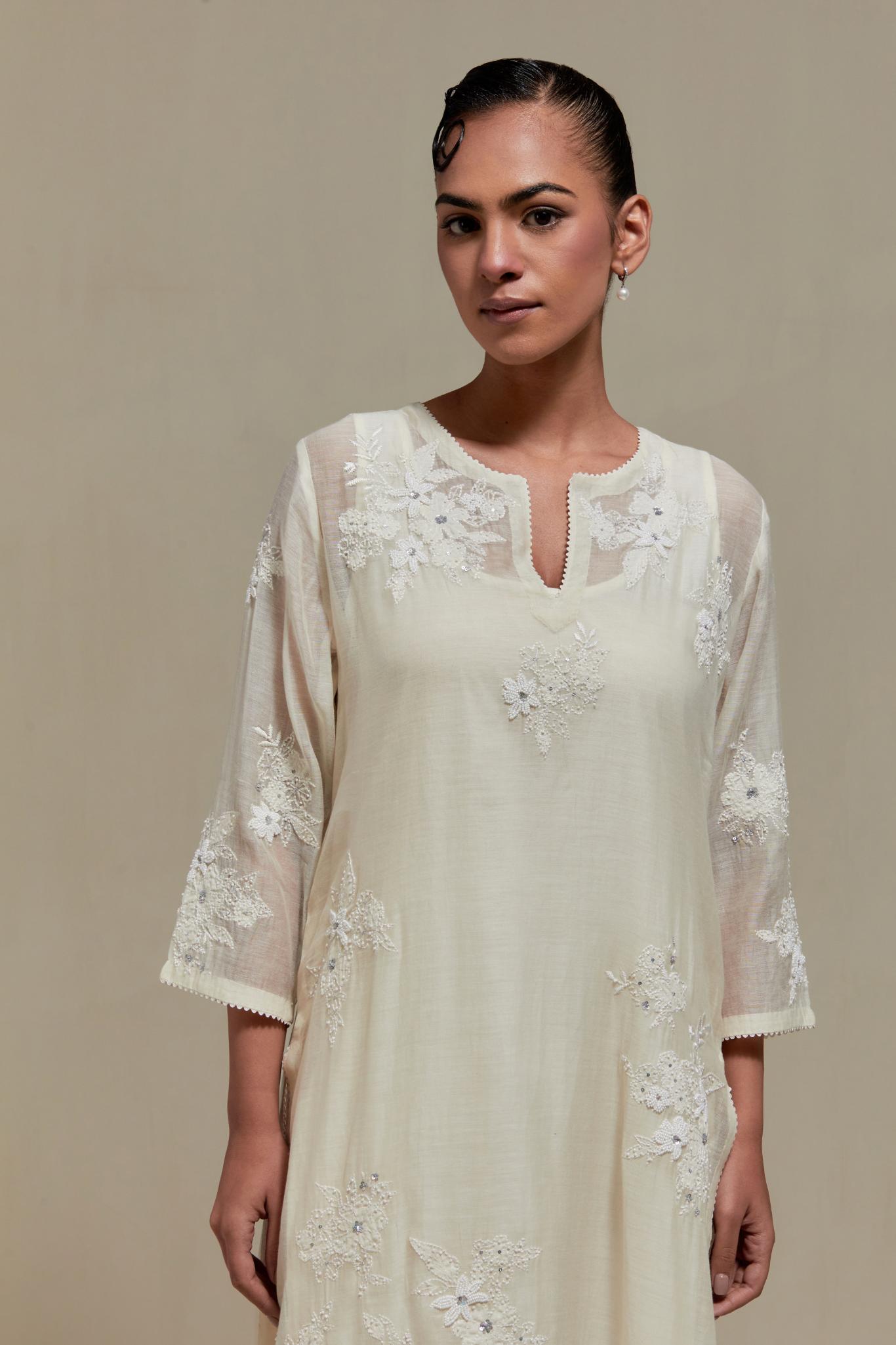 Off white cotton Chanderi short kurta set with all-over appliqué, highlighted with sequins and beads.