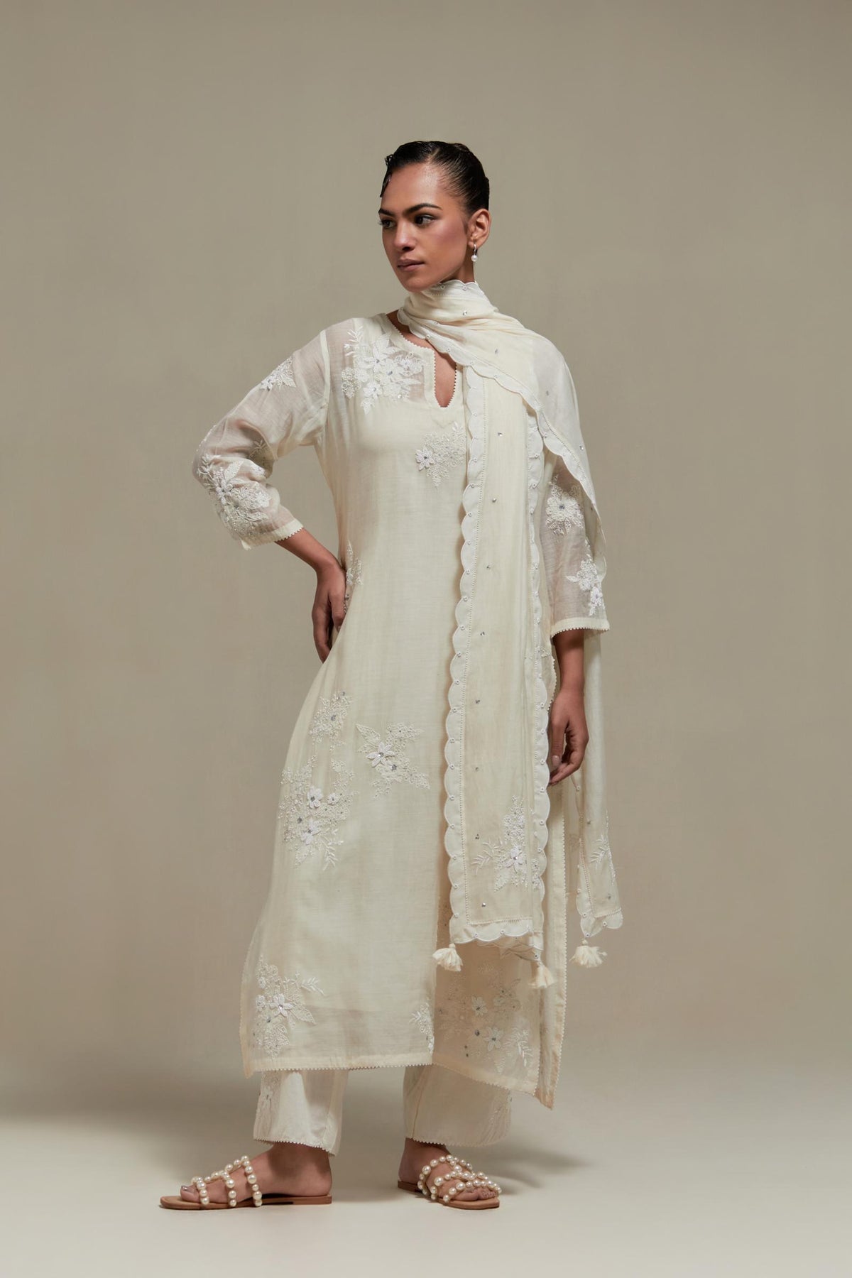 Off white cotton Chanderi short kurta set with all-over appliqué, highlighted with sequins and beads.