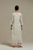 Off white straight kurta set with all-over appliqué motifs, highlighted with sequins and beads.