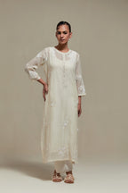 Off white straight kurta set with all-over appliqué motifs, highlighted with sequins and beads.