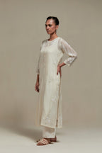 Off white straight kurta set with all-over appliqué motifs, highlighted with sequins and beads.