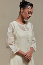 Off white straight kurta set with all-over appliqué motifs, highlighted with sequins and beads.