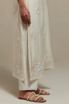 Off white straight kurta set with all-over appliqué motifs, highlighted with sequins and beads.