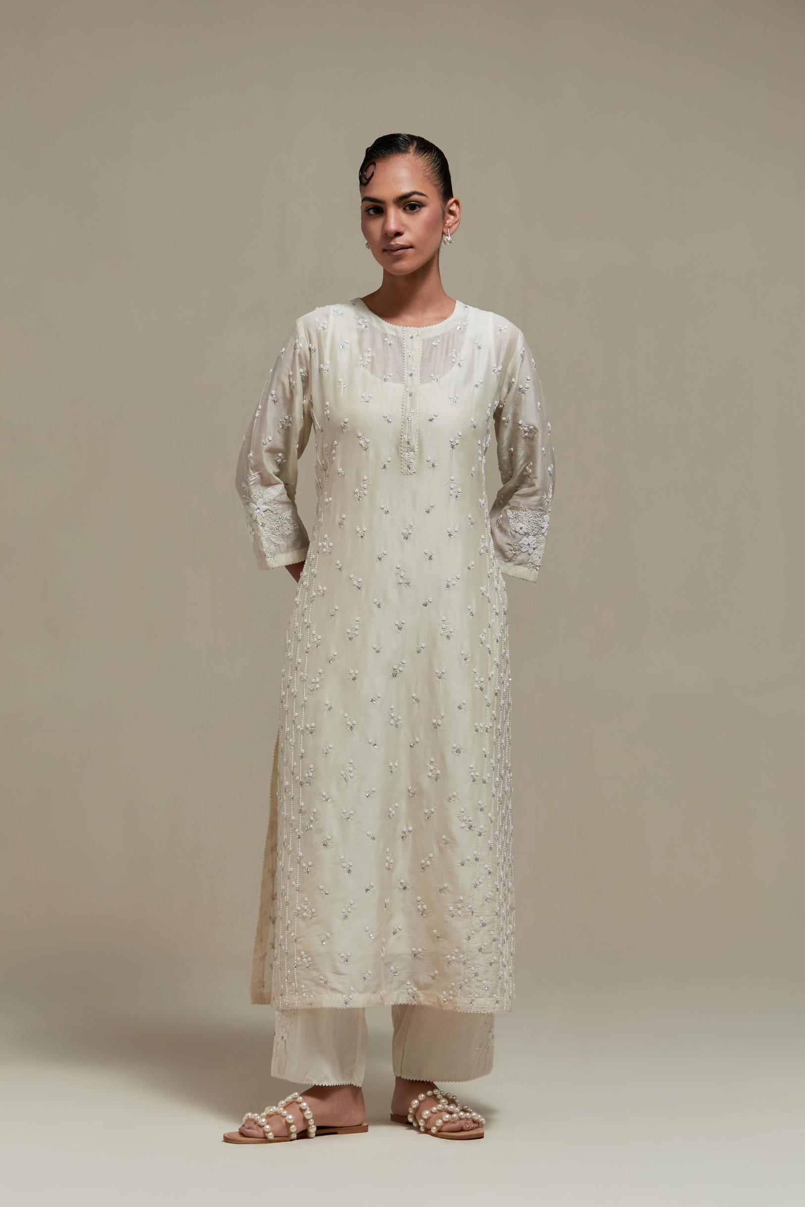 Off white silk Chanderi straight kurta set with all-over delicate embroidered flowers, highlighted with sequins and beads.