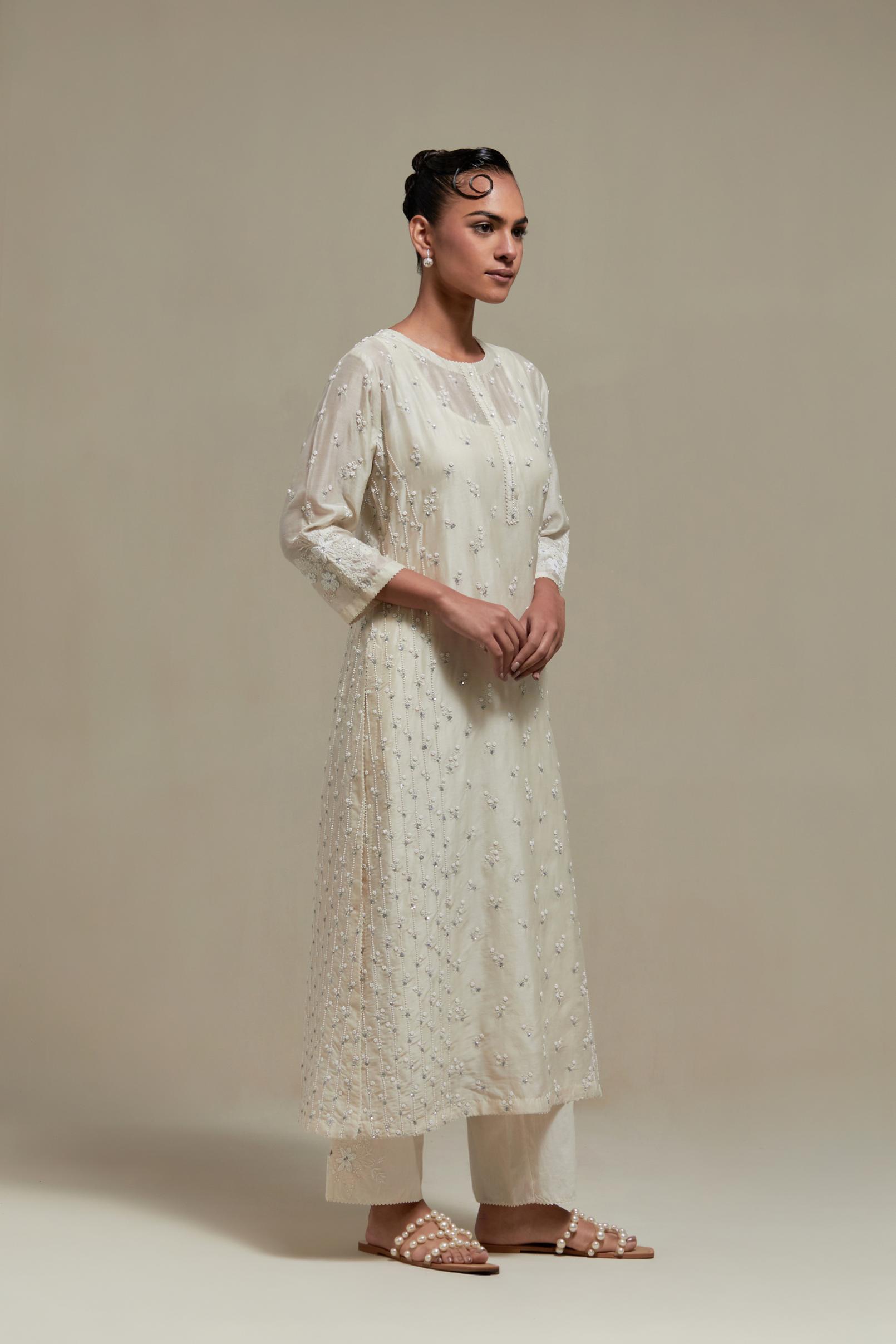 Off white silk Chanderi straight kurta set with all-over delicate embroidered flowers, highlighted with sequins and beads.
