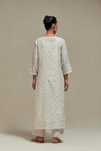Off white silk Chanderi straight kurta set with all-over delicate embroidered flowers, highlighted with sequins and beads.